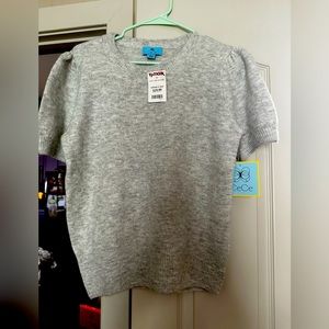 Gray sweater with tags.